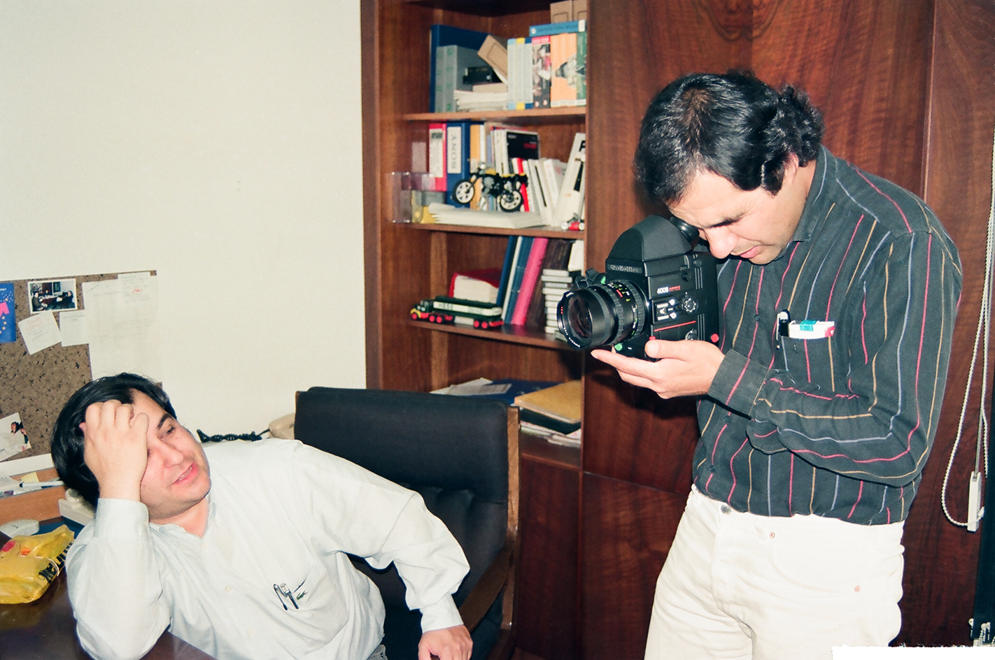 Photographer at work with a subject lying on the floor
